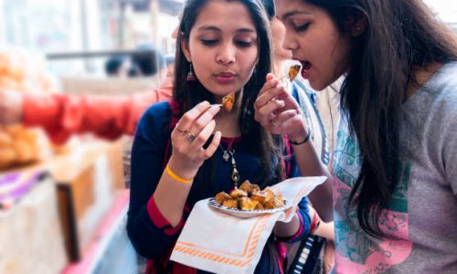 Indian teenagers friends enjoying Indian food outdoor shoot